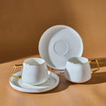 White Porcelain Cup and Saucer Set with Gold Handle, Set of 2 by Unknown